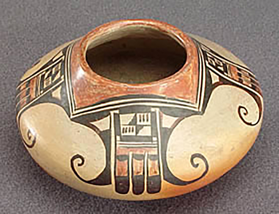 Oblique view, small polychrome jar with abstract eagle motifs, around 1900-1910. (ASM 80-45-2).