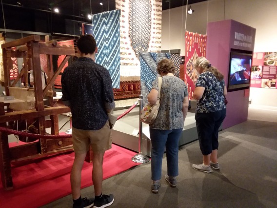People viewing an exhibit during a group visit