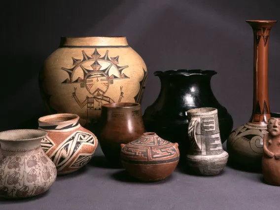 an assortment of southwestern Native pottery on a field of gray 