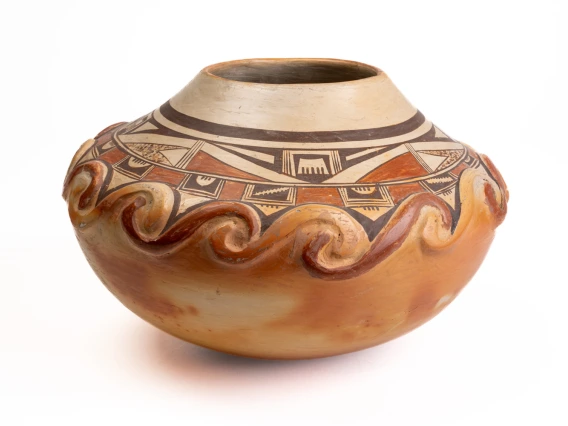 polychrome jar with applique spiral designs