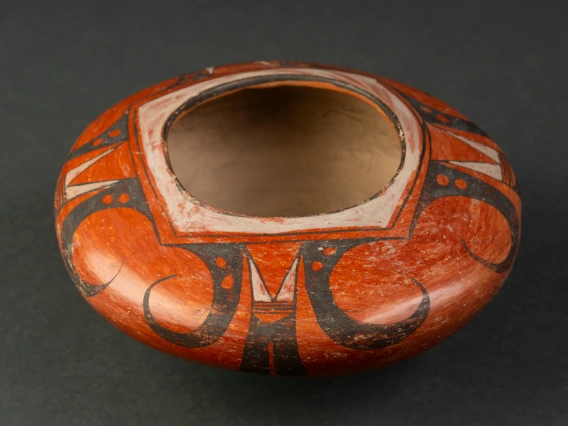 red-slipped polychrome jar with simplified eagle tail design