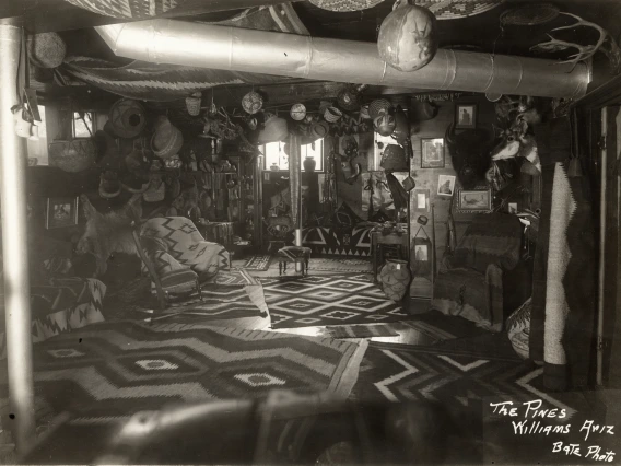 A view of a living room in a 1915 home in Williams, Arizona, filled with Native American textiles, pottery and basket. 