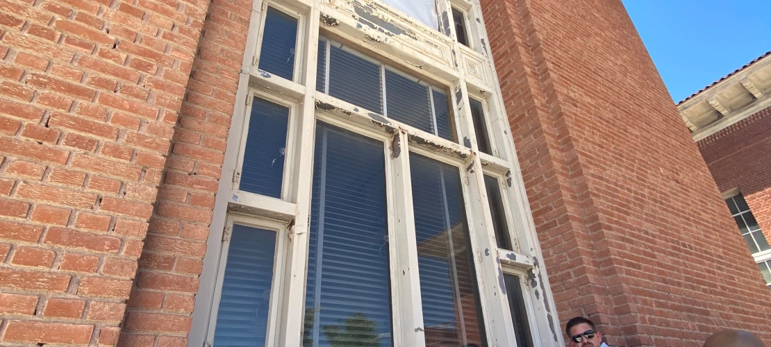 contractors inspecting the condition of windows in north building