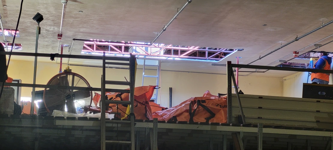 Holes in the ceiling are complete, showing sunlight streaming in.