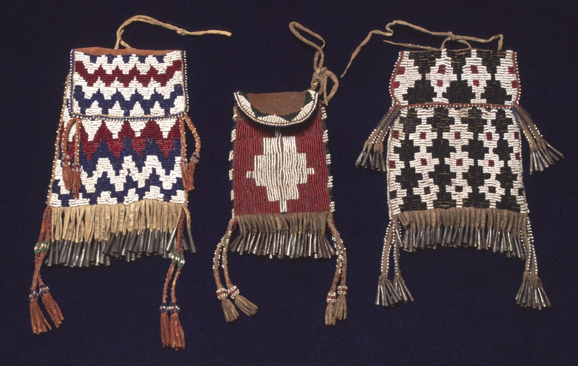 Pouches Tanned hide, glass beads, sinew, metal, ochre