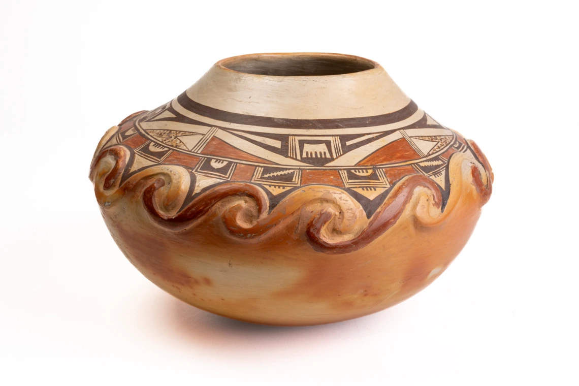 polychrome jar with applique spiral designs