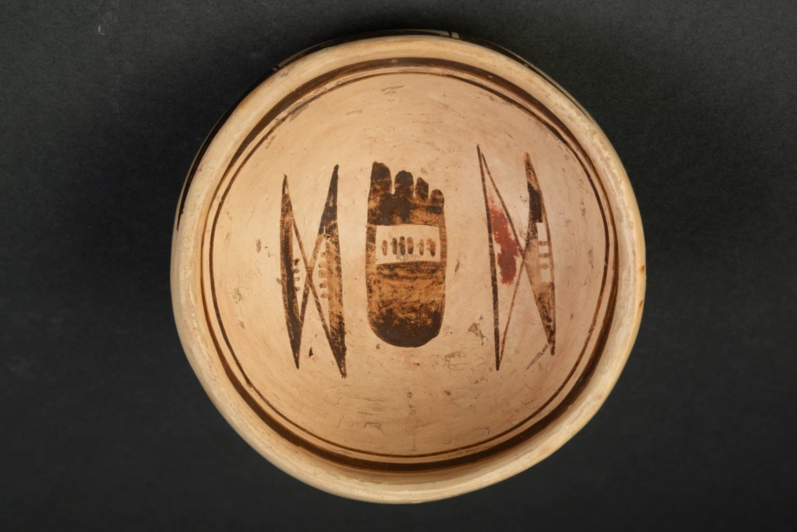 interior view of a hastily painted yellow Hopi bowl