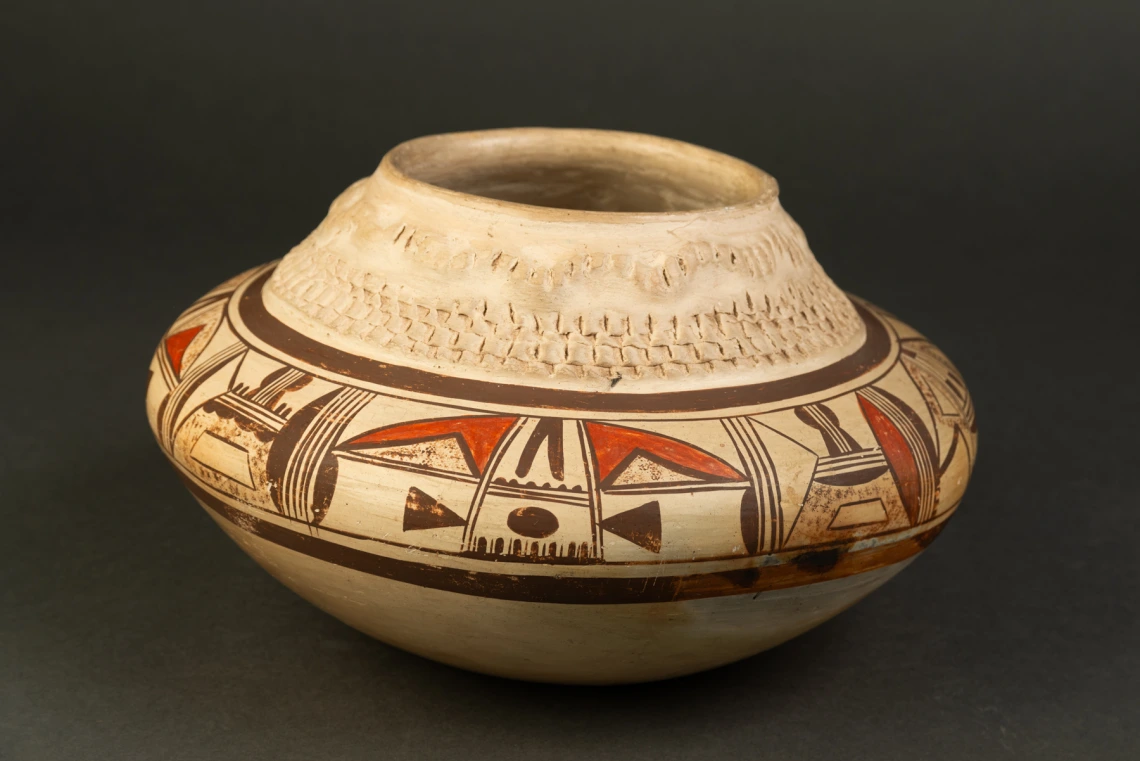 polychrome jar with corrugated and applique designs