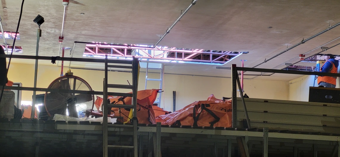 Holes in the ceiling are complete, showing sunlight streaming in.