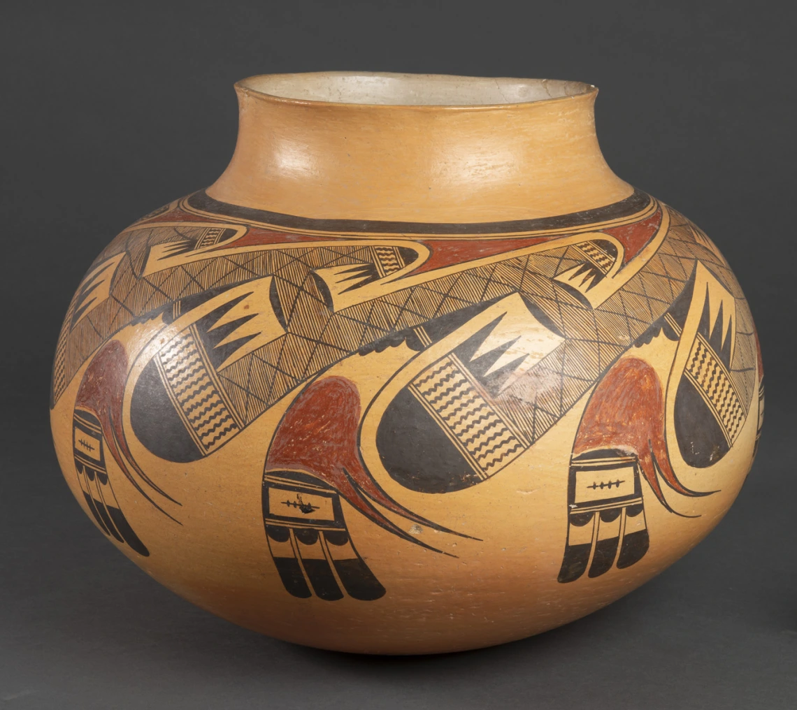 polychrome jar showing a chip on its lip