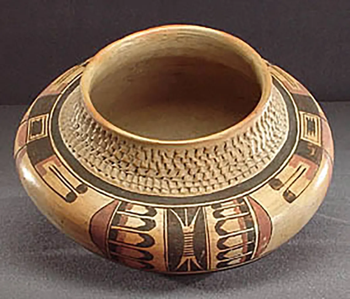 Oblique view, polychrome jar with corrugated neck, around 1920. ASM E-2273.