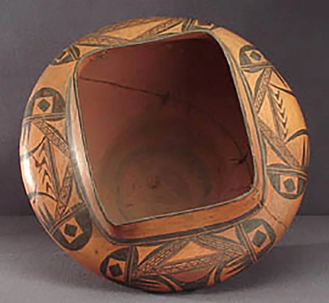 Top view, large square top polychrome olla, around 1920-30. GP52543.