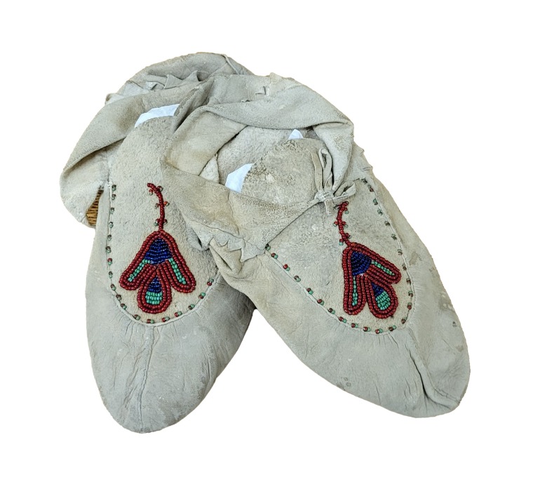 a pair of floral beaded moccasins