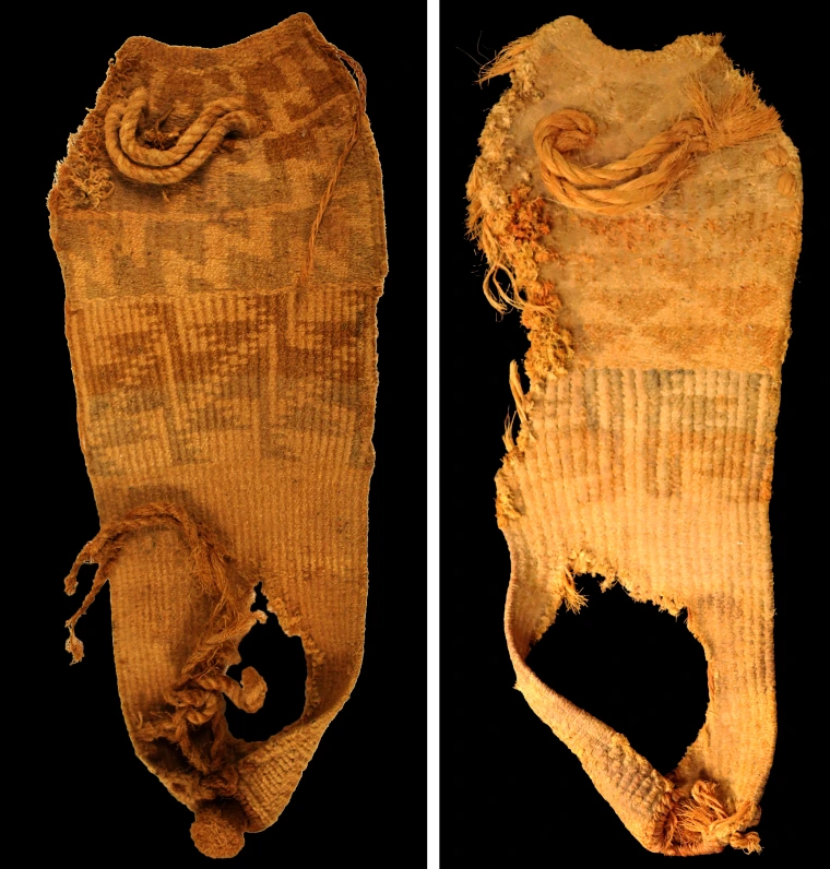 Two sandals side by side. Left: The sandal has a scalloped toe shape and a puckered heel shape. The top of the sandal has several zones of colorful geometric patterns against the ochre background color. Right: The sandal has a scalloped toe shape and a puckered heel shape. The top of the sandal has several zones of colorful patterns including triangles against the ochre background color.