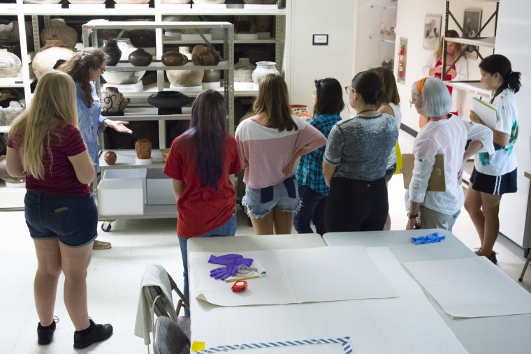 Diane Dittemore, associate curator of ethnology, giving a tour to a University of Arizona art history class