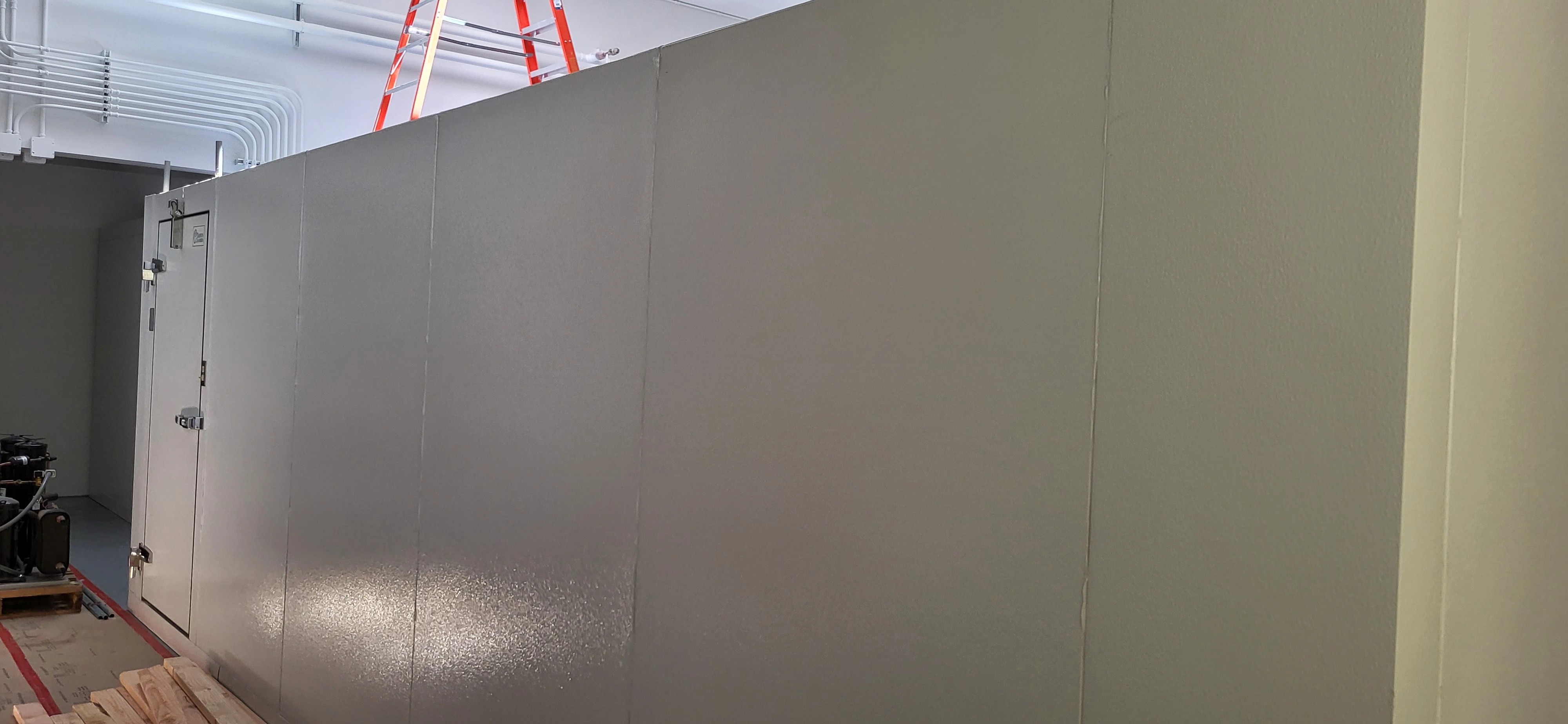 what looks like a large metal box is actually a walk-in freezer