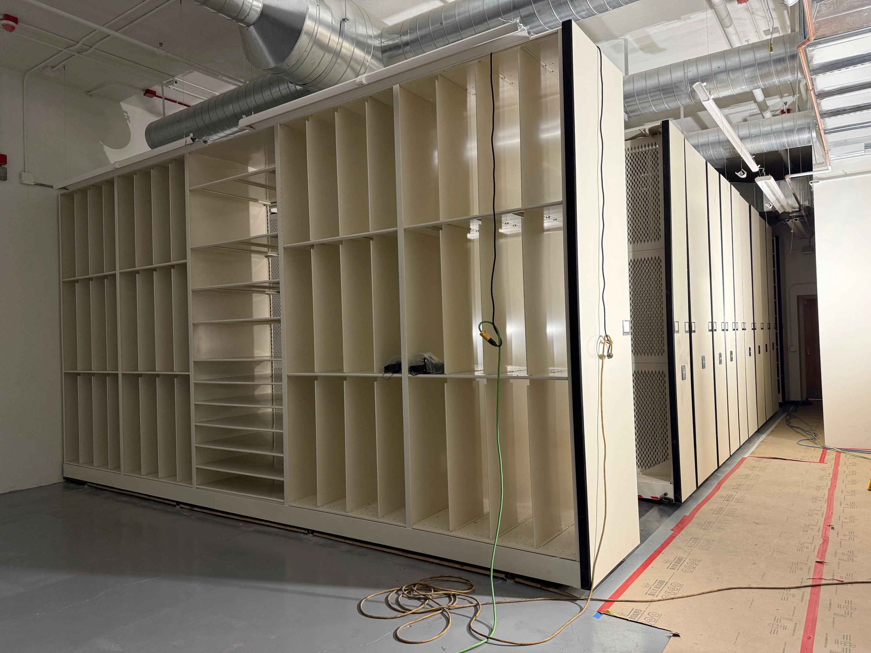 this photo shows compactor shelving being installed