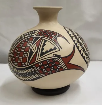 narrow necked polychrome vessel on beige field