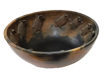 large bowl with horned toad applique on the interior 