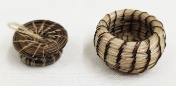 miniature basket with lid made out of black and white horsehair