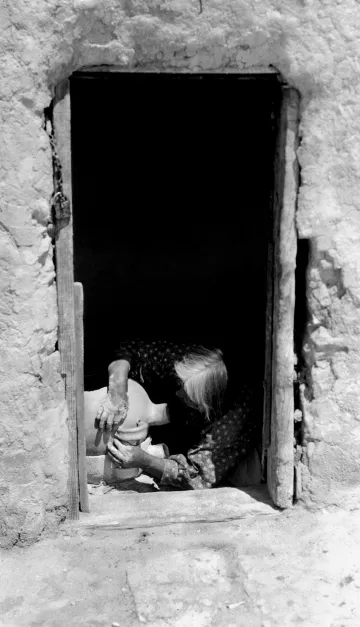 Hopi woman making a canteen