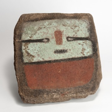 Painted stone slab bearing katsina imagery from Point of Pines. Photo (ASM Catalog No. A-5303) by Jannelle Weakly