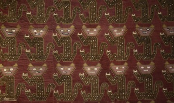 red fabric with pattern of animals