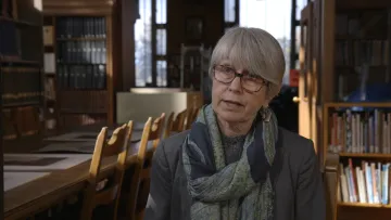 Adult sitting in a library